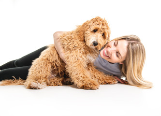 woman with his Golden Labradoodle dog isolated on white background