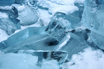 Sun rays are refracted by the transparent ice of Lake Baikal. crystal clear ice fragments — hummocks