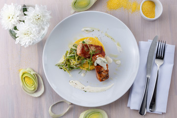 grilled salmon wrapped in bacon and polenta salsa flat lay