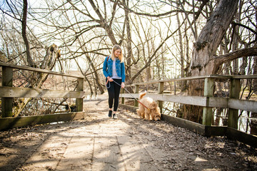 Happy Labradoodle Dog and woman outside at the park