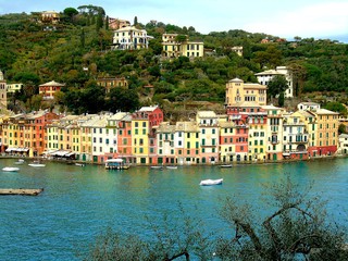 PORTOFINO , ITALY - MAY 02, 2019: The beautiful Portofino with colorful houses and villas, luxury yachts and boats in little bay harbor. Liguria, Italy, Europe