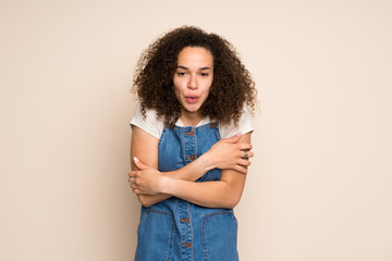 Dominican woman with overalls freezing