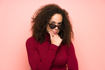 Dominican woman with turtleneck sweater laughing