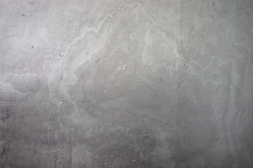 Naklejka premium Natural plaster gray texture. The wall is made of concrete, the surface is textured, gray.