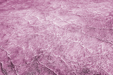 Pattern of sea waves toned in lilac and white blend