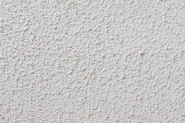 Light textured plaster on the wall. The wall is rough without seams modern decor.