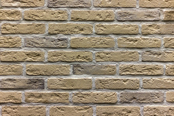 background wall of the old multi-colored brick closeup