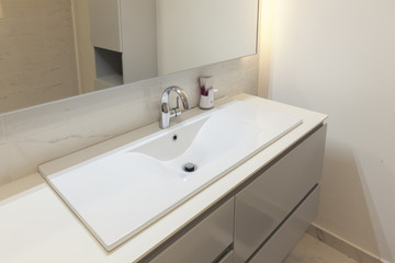 sink and mirror in a modern bathroom