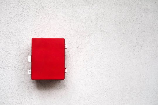 The Red Emergency Box On White Wall