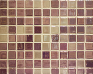 background mosaic tile of brown and beige squares of different tones and transparency monochromatic and with texture and ornament