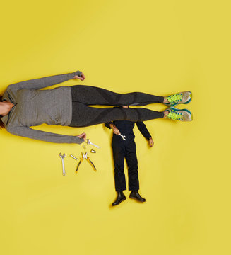 Woman lying down being inspected by a mechanic
