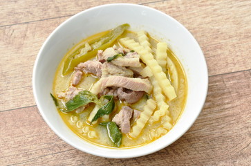 spicy boiled chicken with coconut shoot in curry on bowl