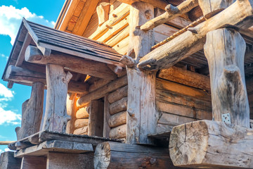 Ecological wooden house. Wooden house with meadow in front of it. Beautiful modern wooden house.