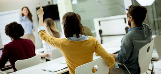 Students rising hands to answer the question during the workshop training