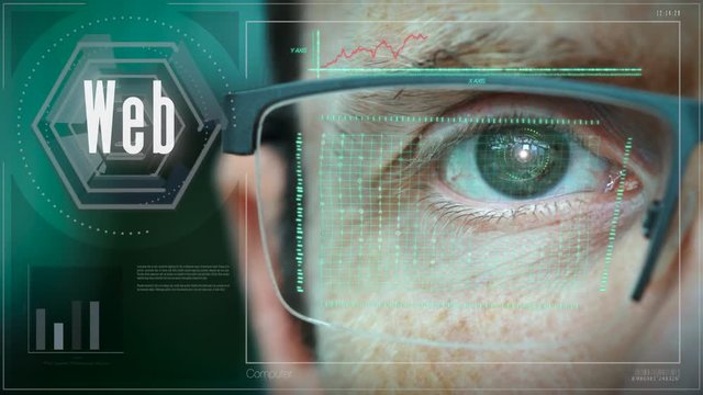 A close up of a businessman eye controlling a futuristic computer system with a Web Business concept.