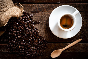 Coffee in a cup on a wooden table, 