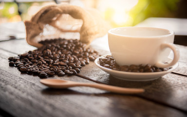 Coffee in a cup on a wooden table, 