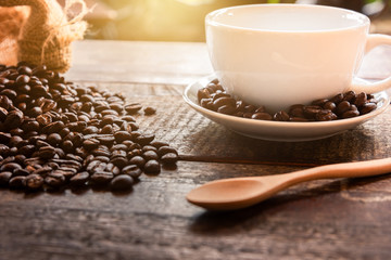 Coffee in a cup on a wooden table, 