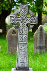 Old celtic cross at a cemetery in England.