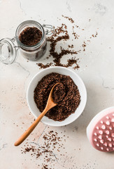 Homemade anti-cellulite coffee sea salt olive oil scrub on a light background,s the view from the top. Beauty concept