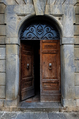Fototapeta na wymiar Open antique door in classic Italian style.