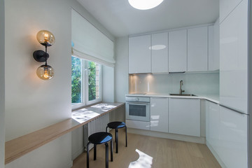 Space-saving solution for small kitchen. Bright small kitchen room