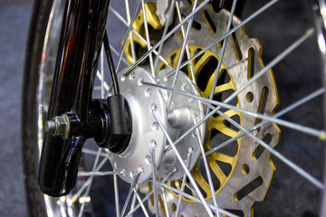 Fototapeta na wymiar Closeup detail Motorcycle wheels, wire spokes of a motorcycle
