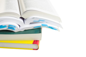 Stack of new colorful books isolated on a white background.            Selective focus.