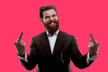 Portrait of a bearded man, dressed in suit, showing middle finger gesturing, isolated on screen...