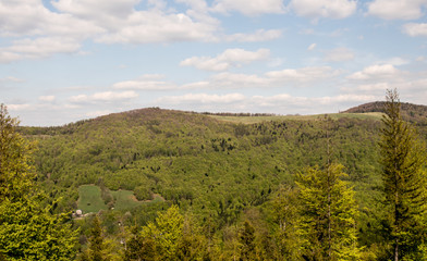 Fototapeta na wymiar Hala Jaworowa on Kotarz hill from view tower on Stary Gron hill in spring Beskid Slaski mountains in Poland