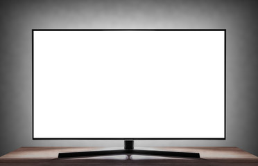 Smart TV in the room in the interior with a blank white screen.