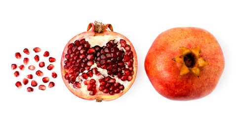 Ripe pomegranate, bullock and grains on a white. The form of the top.