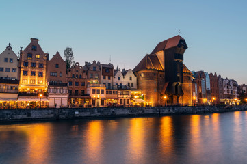 Fototapeta na wymiar Old town of Gdansk on bank of Motlawa River at dusk