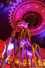 giraffe statues with pink lights