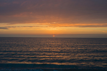 Beautiful sunset over the sea. Bright sunset sky with clouds. Black sea, Anapa, Krasnodar region,...