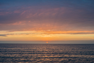 Beautiful sunset over the sea. Bright sunset sky with clouds. Black sea, Anapa, Krasnodar region, Russia