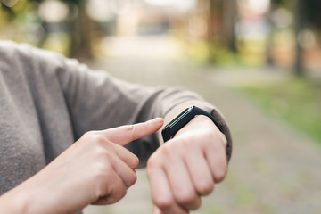 woman using smart watch