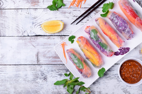 Fresh Spring Rolls With Pepper, Red Cabbage, Carrot And Other Vegetables. Vietnamese Cuisine Meal