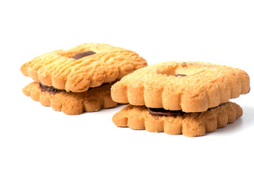 Peanut butter cookie on a white background. Golden homemade biscuit with a missing bite and trail of crumbs.