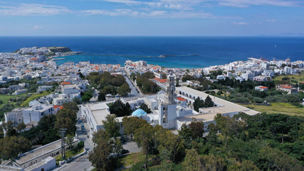 Obraz premium Aerial drone panoramic photo of iconic orthodox church of Lady of Tinos island or Church of Panagia Megalochari (Virgin Mary), Cyclades, Greece