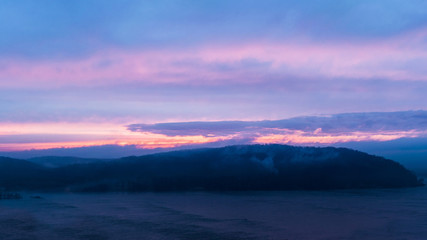 Fototapeta na wymiar Colorful sky during sunset ,looking across the Susquehanna River toward Wrightsville, Lancaster County, PA