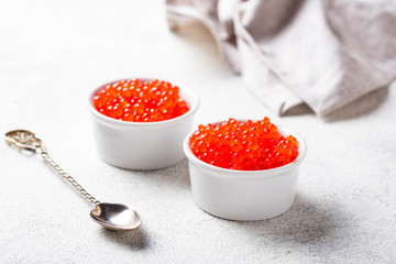 Two bowls with red salmon caviar