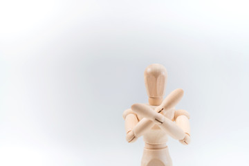 Refusal gesture, Wooden dummy, crossed hands on white background, copy space for your object or text