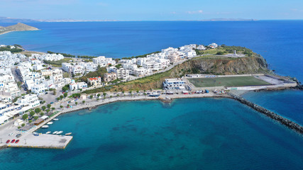 Naklejka na ściany i meble Aerial drone photo of iconic main town and port of Tinos island featuring monastery of Panagia Megalochari (Virgin Mary), Cyclades, Greece
