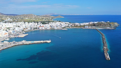 Aerial drone photo of iconic main town and port of Tinos island featuring monastery of Panagia Megalochari (Virgin Mary), Cyclades, Greece