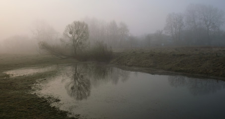 Fototapeta na wymiar Misty morning on the river. Dawn