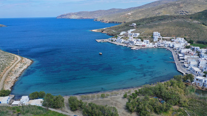 Obraz premium Aerial drone photo of picturesque beautiful fishing village and small harbour of Panormos, Tinos island, Cyclades, Greece