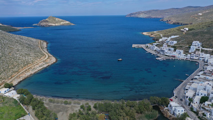 Obraz premium Aerial drone photo of picturesque beautiful fishing village and small harbour of Panormos, Tinos island, Cyclades, Greece