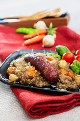 Homemade Sausage Cooked lentils with baby onions and carrots
