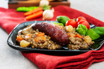 Homemade Sausage Cooked lentils with baby onions and carrots